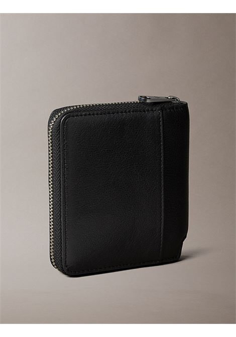 Portafoglio a libro in pelle con zip CALVIN KLEIN | LV04D1077GUB1